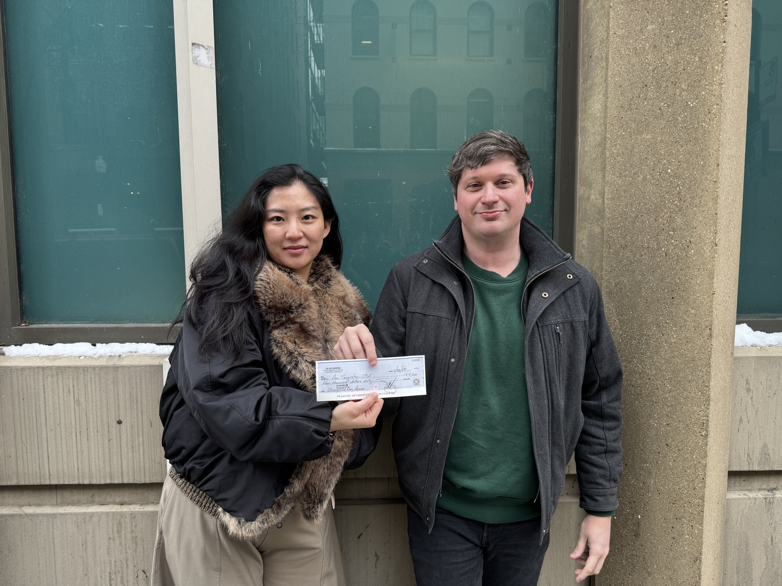 LL and CR holding donation